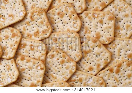 Tuc Original Snack Crackers Lies On Market Table Stacked In Big Pile