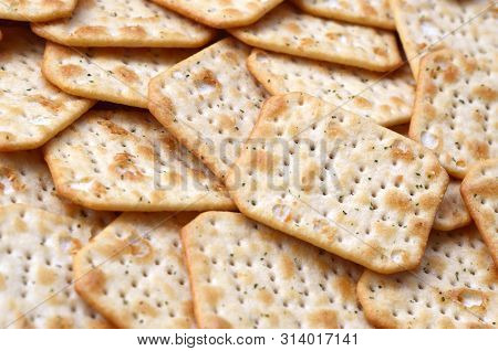 Tuc Original Snack Crackers Lies On Market Table Stacked In Big Pile