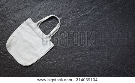 White Tote Canvas Fabric Eco Bag Cloth Shopping Sack On Dark Background / Zero Waste Use Less Plasti