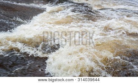 Water Flood On River After Heavy Rain Rapids Water Flow Copiously From Mountain Stream In The Forest
