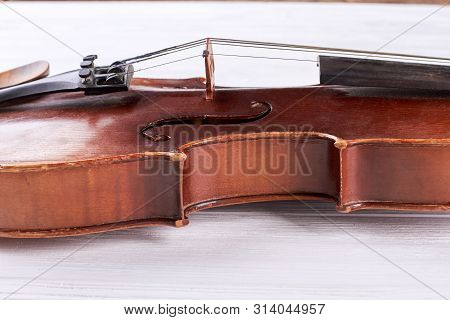Waist Of A Violin. Old Violin Waist Detail. Classical Musical Instrument Close Up.