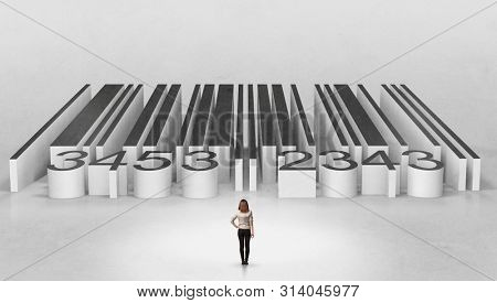 Young businessman standing in front of a big codebar