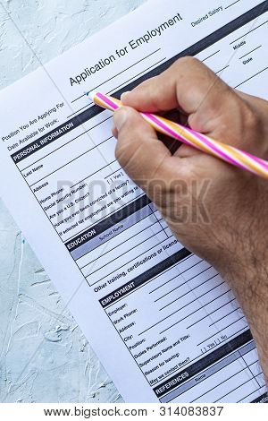 Hand Filling Standard Application For Employment. Hr, Hiring, Applicant Filling Job Application. Hr,