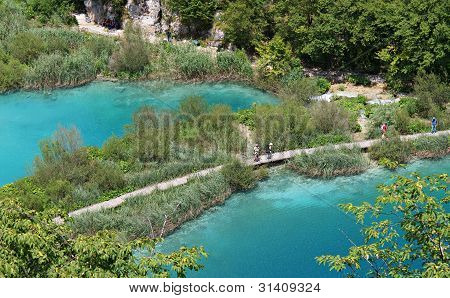 Plitvice, Croatia - July 7: Tourist Enjoy Sightseeing The Lakes And Wonderful Landscapes At The Plit