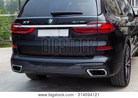 Novosibirsk, Russia - 07.20.2019: Black New Bmw X7 Xdrive40i 2019 Year Rear View With Lifht Gray Int
