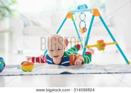 Baby Boy With Toys And Ball