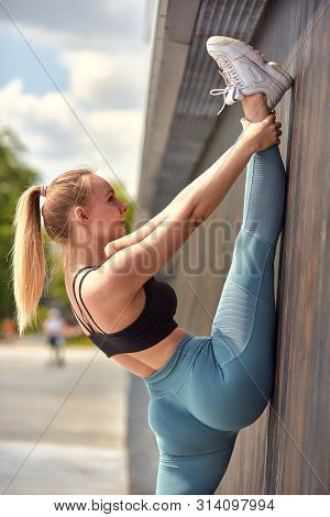 Beautiful Athletic Young Girl Gymnast In Sportswear, Working Out, Element Of Gymnastics, Doing The S