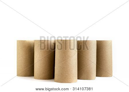 Five Cardboard Paper Tubes On White Background. Close-up Of Empty Toilet Rolls