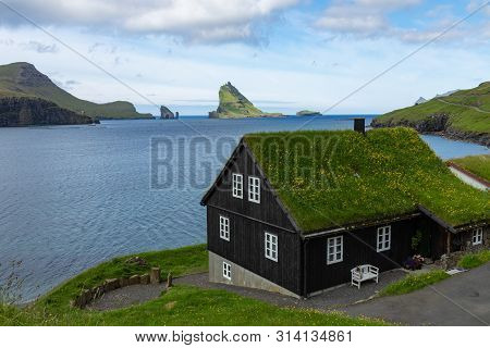 Bour Village. Typical Grass-roof Houses And Green Mountains. Vagar Island, Faroe Islands. Denmark. E