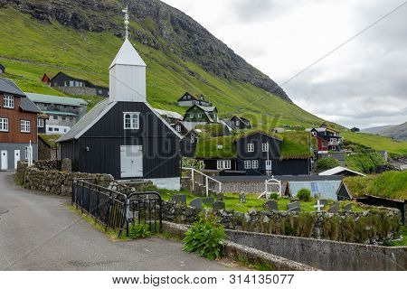 Bour Village. Typical Grass-roof Houses And Green Mountains. Vagar Island, Faroe Islands. Denmark. E