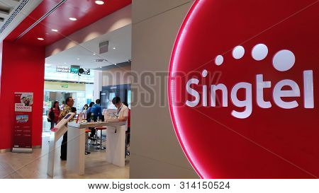 Singapore, 27 Jul, 2019: Customers Visit Singtel Retail Shop In Singapore. Singtel Ltd Is One Of The