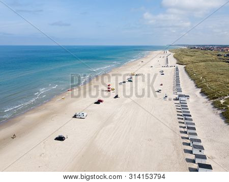 Lokken, Denmark - July 18, 2019: Aerial Drone View Of Lokken Beach With Cars And Beach Huts.
