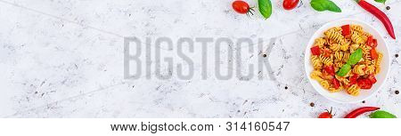 Radiatori Pasta With Chicken And Peppers On White Background. Top View. Banner.