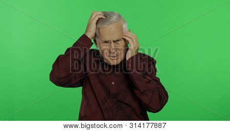 Senior Man Suffer By Headache Pain Trouble Holding Head With Hands. Handsome Old Man On Chroma Key B