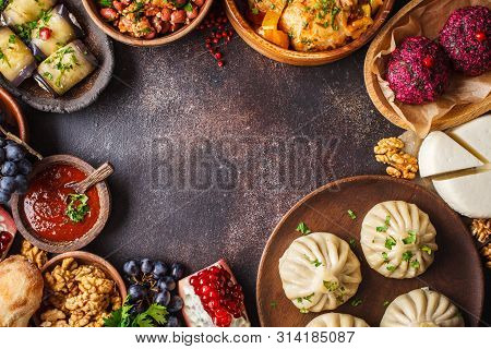 Traditional Georgian Cuisine Background. Khinkali, Phali, Chahokhbili, Lobio, Cheese, Eggplant Rolls