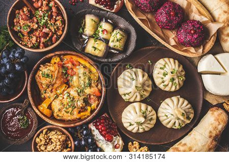 Traditional Georgian Cuisine Background. Khinkali, Phali, Chahokhbili, Lobio, Cheese, Eggplant Rolls