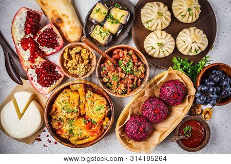 Traditional Georgian Cuisine Background. Khinkali, Phali, Chahokhbili, Lobio, Cheese, Eggplant Rolls