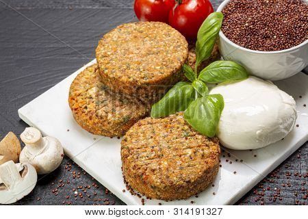 Tasty Vegetarian Burgers Made From Healthy Quinoa, Basil, Tomatoes And Mozzarella Cheese Close Up
