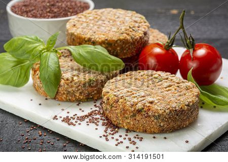 Tasty Vegetarian Burgers Made From Healthy Quinoa, Basil, Tomatoes And Mozzarella Cheese