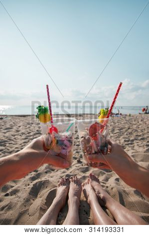 Plastic Pollution In Ocean Environmental Problem, Girls Hands Holding Plastic Cups With Straws And C