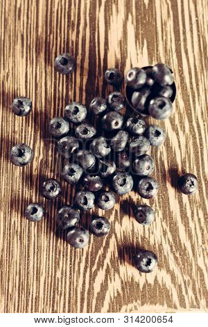 Beautiful Fragrant And Delicious Cyanococcus Berry On A Brown Background And A Beautiful Composition
