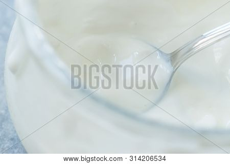 Homemade Goat Yogurt In Glass Bowl With Spoon / Probiotic Custard