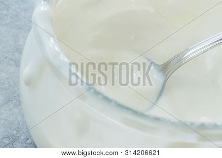 Homemade Goat Yogurt In Glass Bowl With Spoon / Probiotic Custard