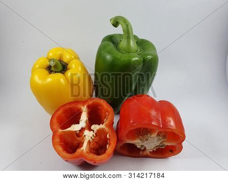 Big colorful sweet pepper on white background.