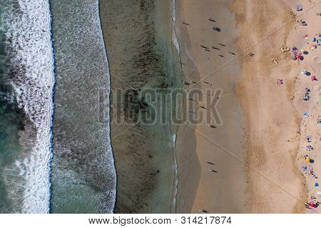 Ocean Waves, Sandy Beach With People Bathing In The Water, View From Drone, Lanzada Beach, Galicia,