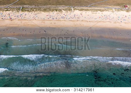 Ocean Waves, Sandy Beach With People Bathing In The Water, View From Drone, Lanzada Beach, Galicia,