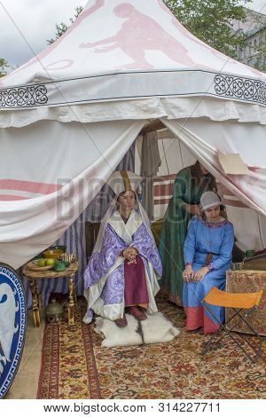 Moscow/ Russia - 15.06.2019: The Princess And The Maid In Ancient Historical Dresses Sit On The Brig