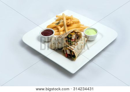 A Low Contrast Hero Shot Of A Chicken Pimiento Sandwich With Samurai & Alger Sauce & Fries On The Si