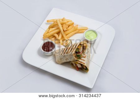 A Low Contrast Hero Shot Of A Chicken Pimiento Sandwich With Samurai & Alger Sauce & Fries On The Si