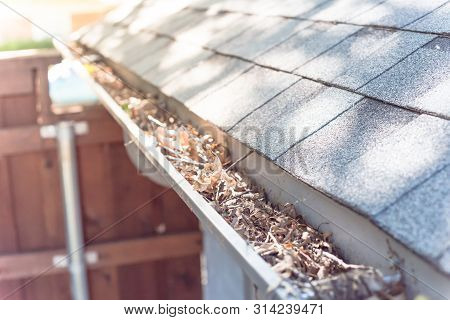 Top View Gutter Blocked By Dried Leaves And Messy Dirt Need Clean-up