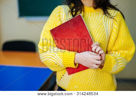 Teacher Or Student At The Blackboard. Back To School. Education. Teacher In Classroom.