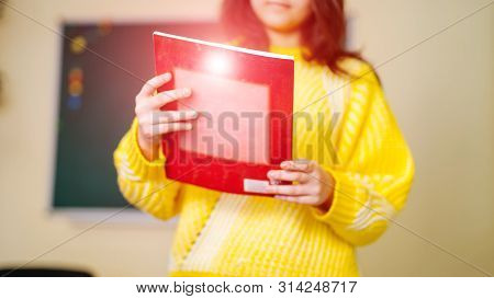 Pretty Female Student With Book. Back To School. Education