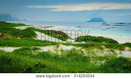 Seascape, Sea Coast With Grassy Dunes And Island Bleiksoya In The Distance, View From Kleivodden Vie