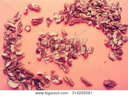 Walnuts On A Pink Background. Very Healthy Food.