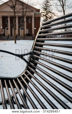 Bench In The Oakgrove On Iup Campus During Winter