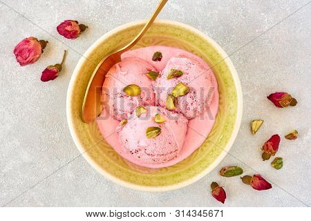 Strawberry Rosewater Ice Cream , Frozen Yogurt With Pistachio And Rosebud. Top View
