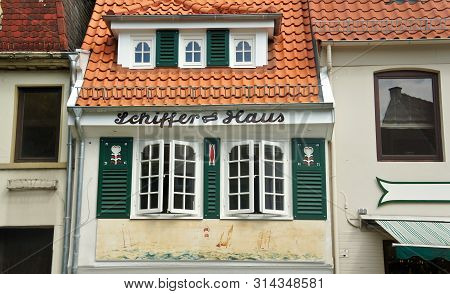 Bremen, Germany - 07 23 2015 - Picturesque View Of Roof And Windows Of House In Medieval Street Schn
