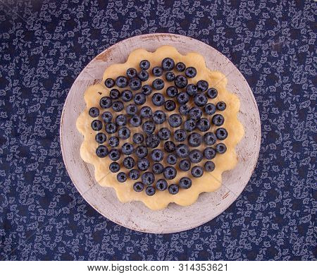 Homemade Cheesecake Decorated With Blueberry Over On Fabric. Top View