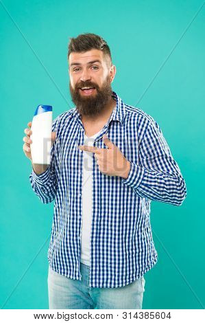 Shampoo For Daily Use. Body Care Cosmetic Bath Shower. Man Hold Shampoo Bottle. Hair Care. Skin Loti