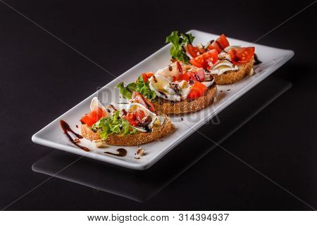 Bruschetta With Tomatoes, Lettuce, Camambert, Balsamic Vinegar