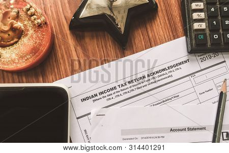 Close Up Of Indian Income Tax Return Form Itr-2 Return Form Is On The Table Next To A Pen, Calculato