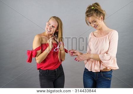 Happy Two Women Holding Paper Decoration Photo Booth Mask Glasses On Stick, Having Fun. Wedding, Bir