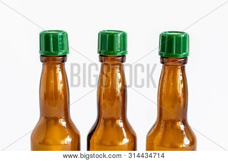 Close-up Front Shoot Of Brown Liquour Bottles With White Background