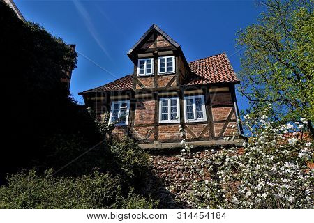 Old House Behind Wall In The City Of Celle, Germany