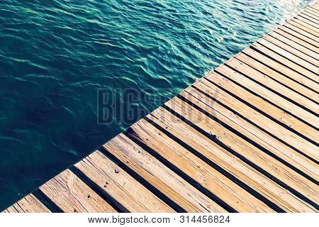 Swimming Pool And Wooden Deck Ideal For Background, Copy Space