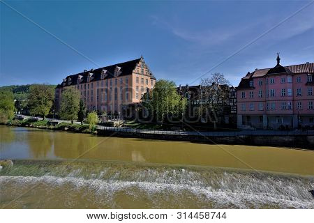 View From Old Werra Bridge To Hann. Munden, Germany With Welfenschloss And City Wall